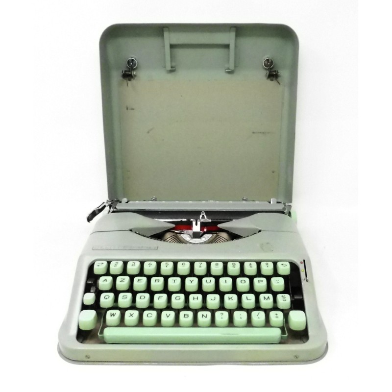Machine à écrire portative Hermès Baby des années 60, en parfait état de fonctionnement et objet de décoration unique.
